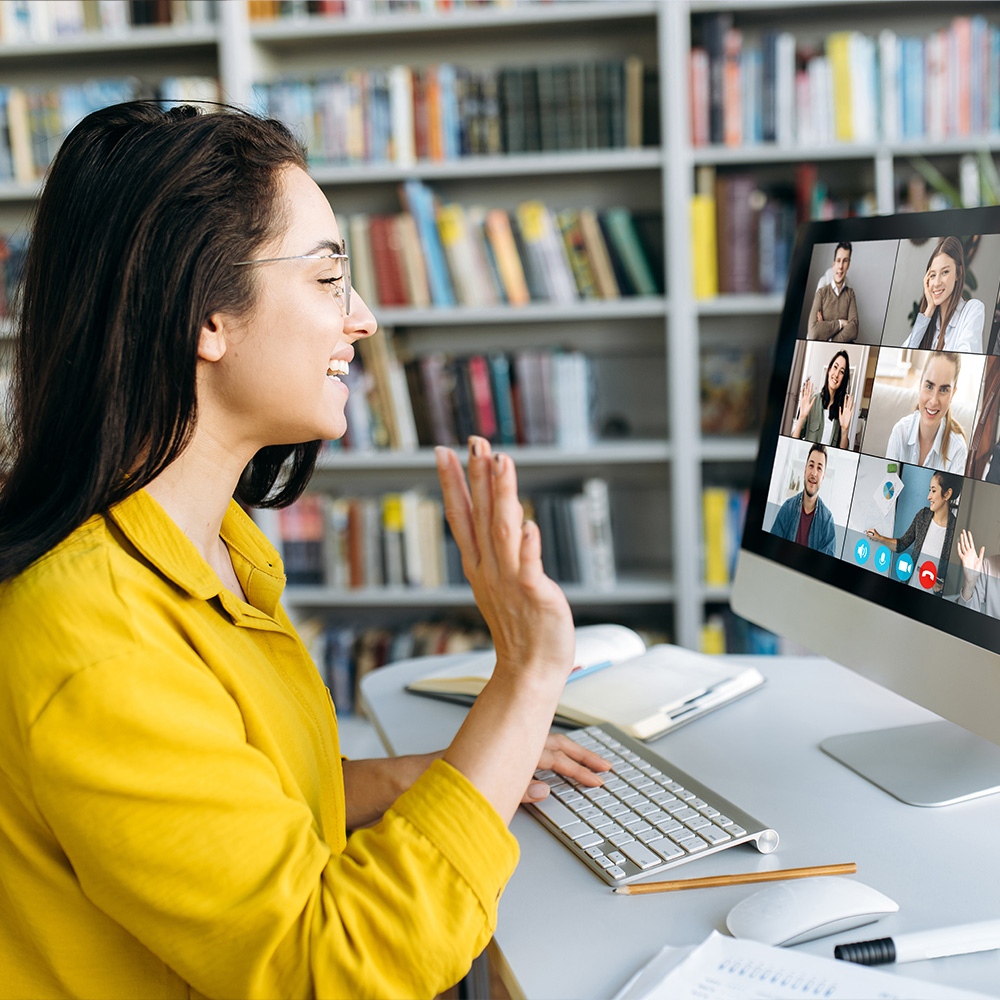 Woman having a virtual meeting with her work team